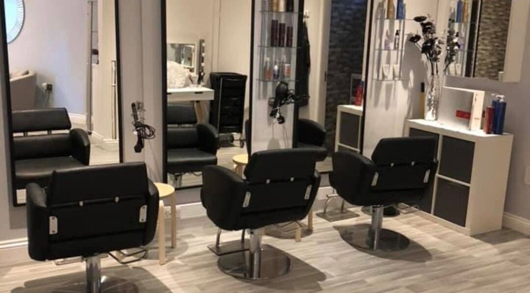 Modern salon interior at Salon27 in Barrowford, England, GB showcasing stylish chairs and mirrors.