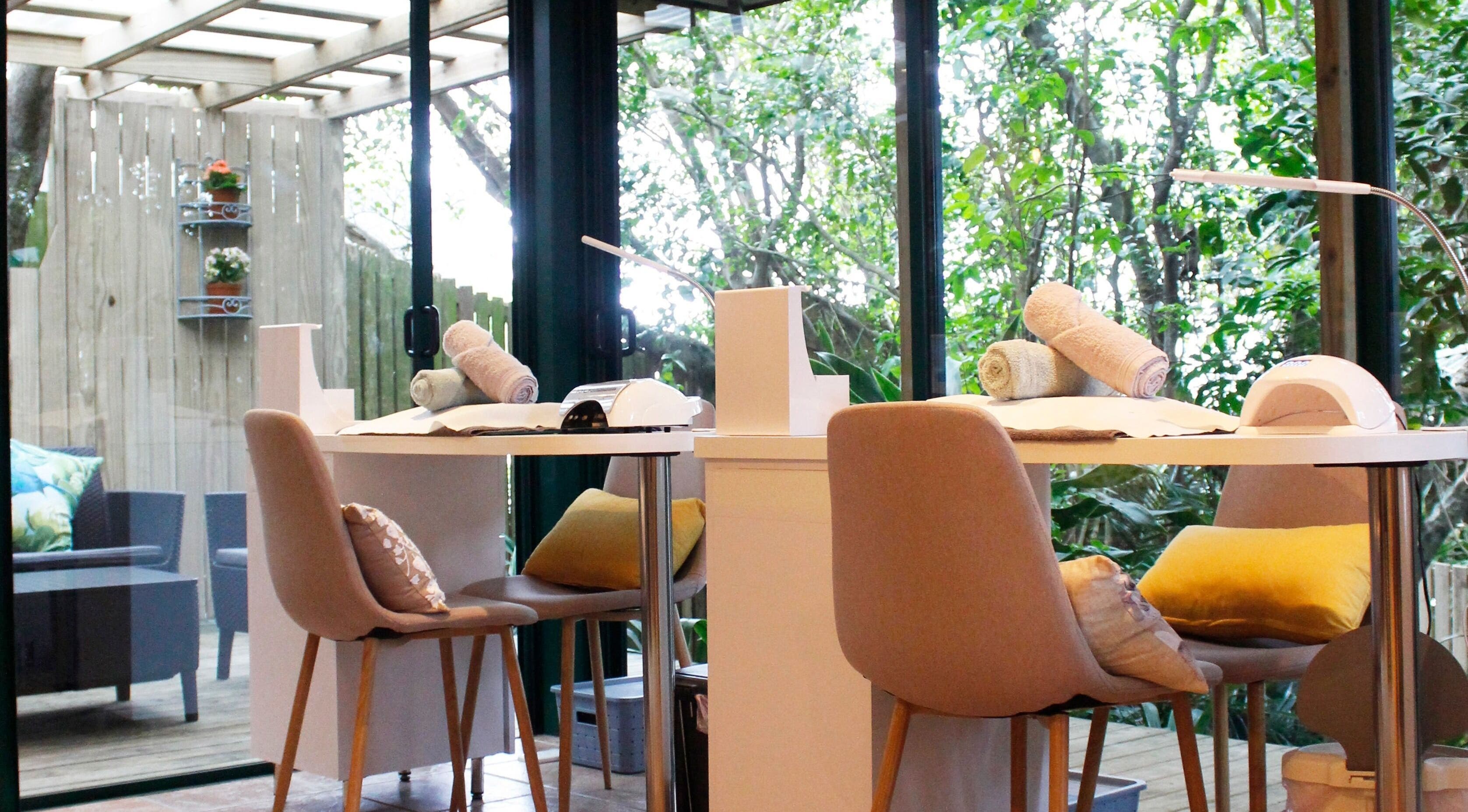 Elegant nail treatment setup at Hayahay Beauty Spa, Umdloti, KwaZulu-Natal, ZA with lush garden view.