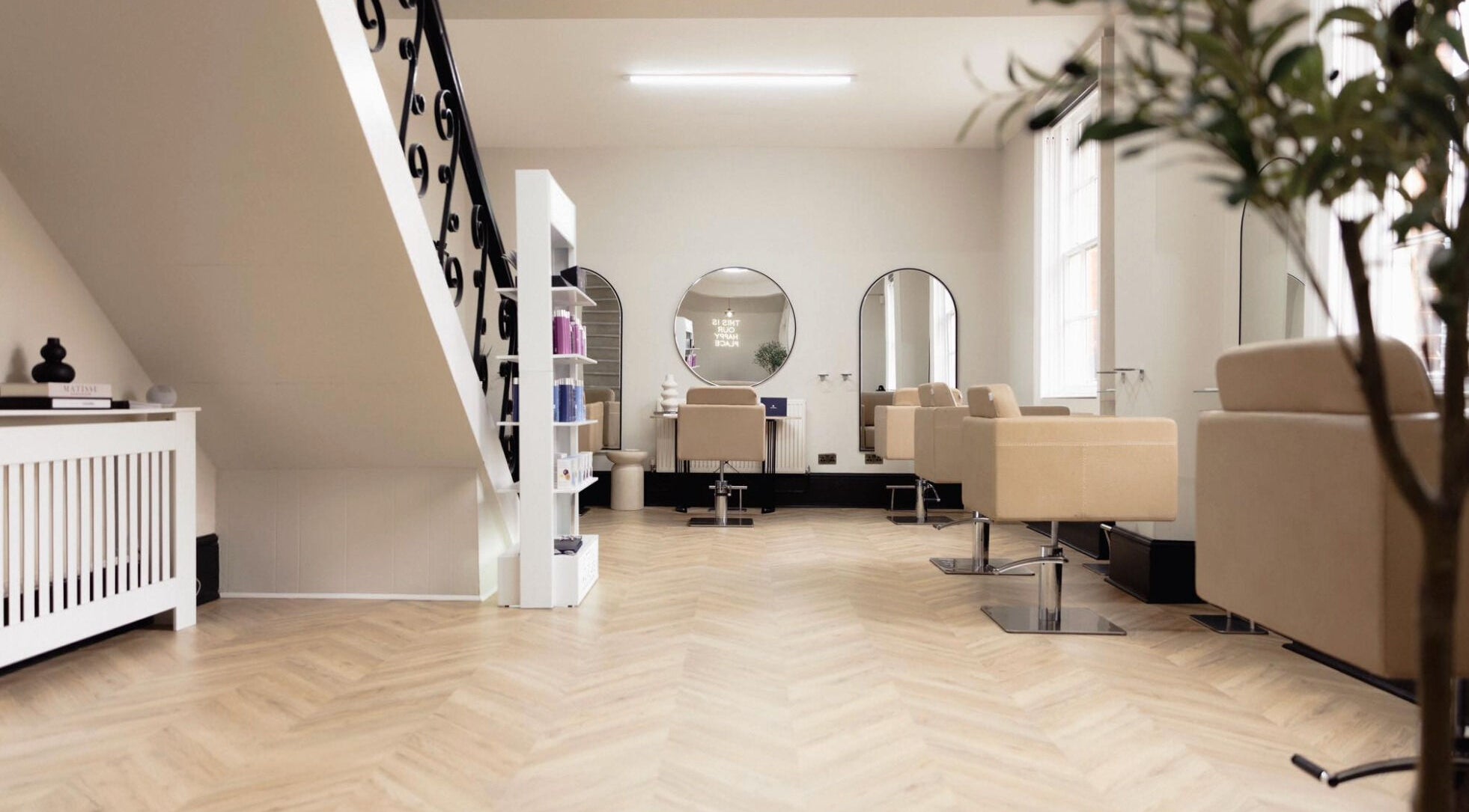 Elegant interior of Ashton Poole Hair Studio, Retford, England, GB, featuring modern chairs and stylish decor.