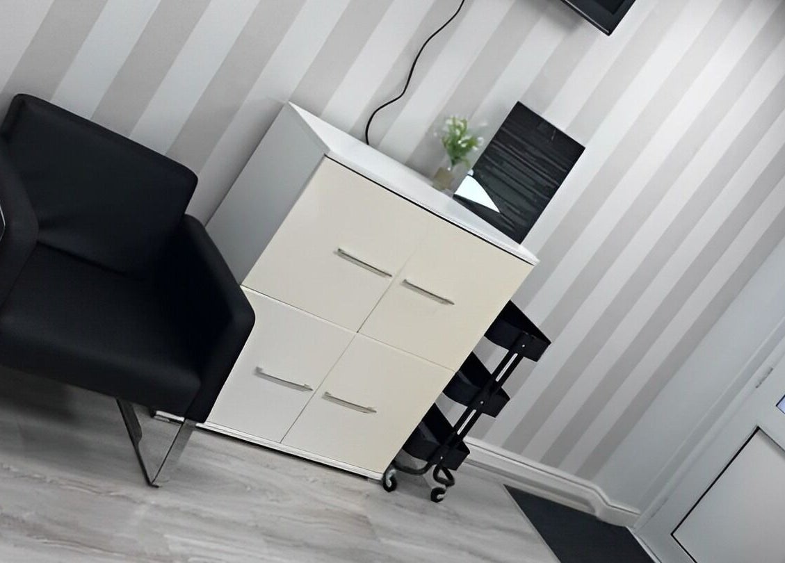 Chic waiting area with stylish chair at Reflect Aesthetics, Blackpool, England, GB offering a sleek ambiance.