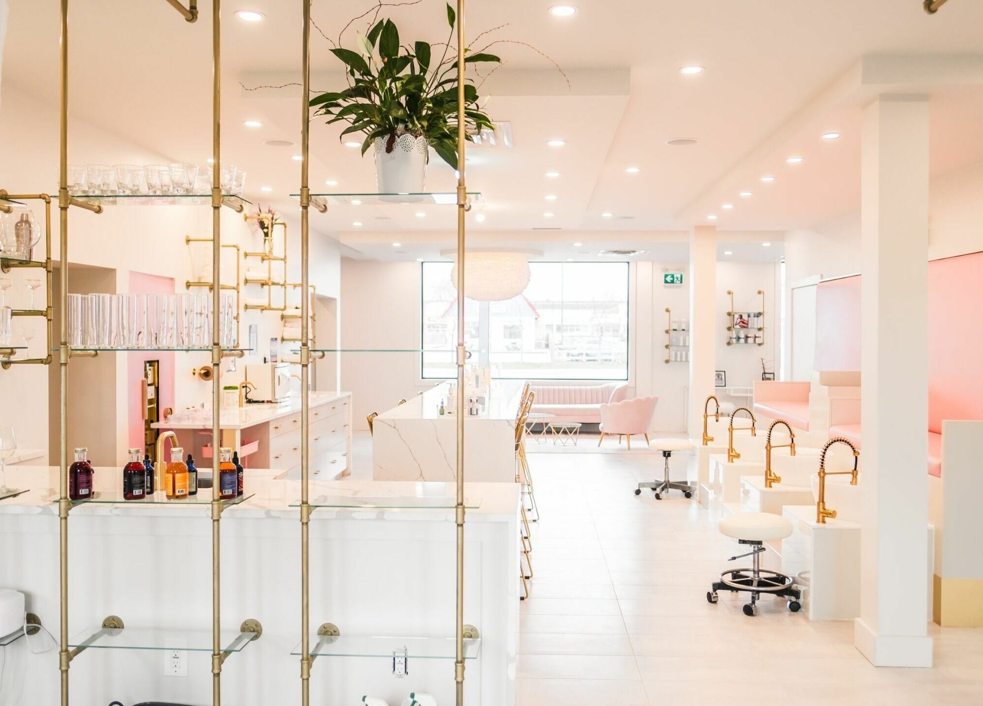 Modern interior of Elixir Beauty Mixology in Niagara Falls, Ontario, CA, featuring elegant decor and seating.