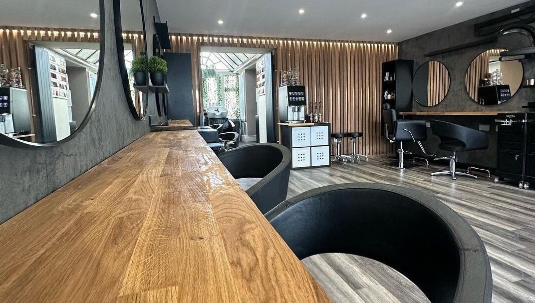 Modern salon interior at BroDans Hair & Beauty Lounge, Cardiff, Wales, GB with elegant decor and styling chairs.