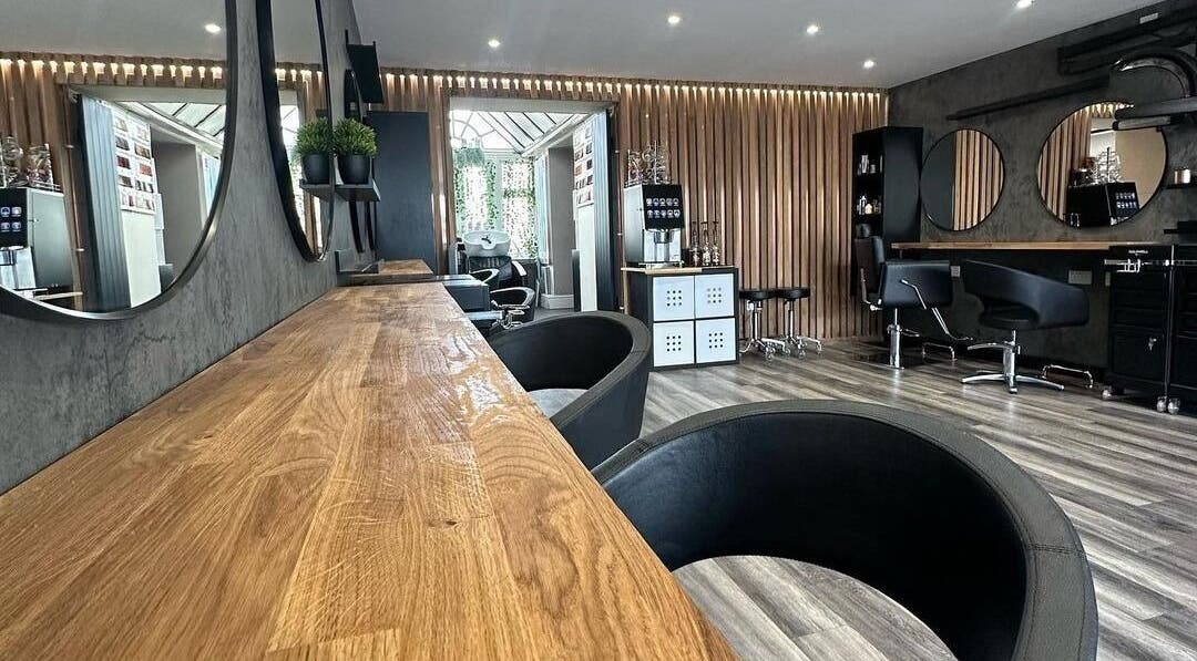 Modern salon interior at BroDans Hair & Beauty Lounge, Cardiff, Wales, GB with elegant decor and styling chairs.