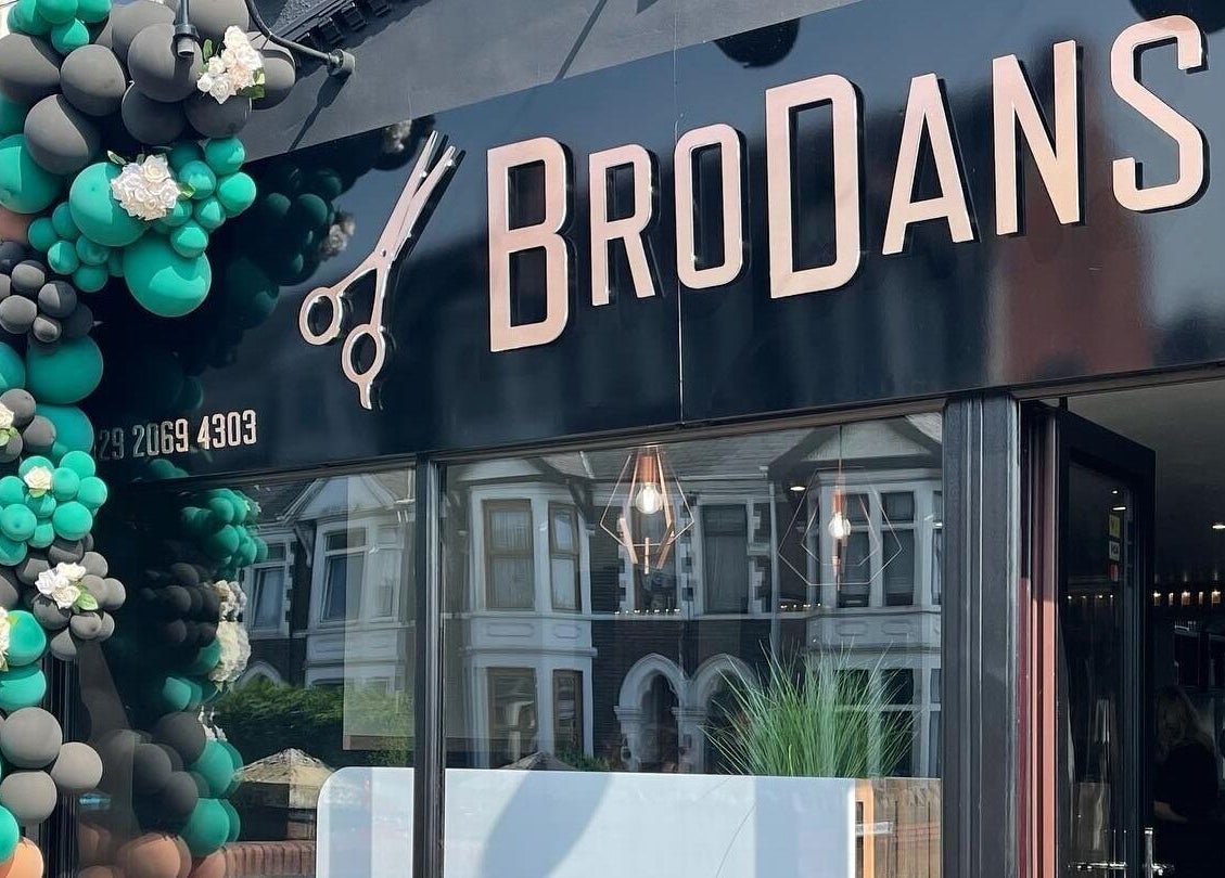 Entrance of BroDans Hair & Beauty Lounge with decorative balloons in Cardiff, Wales, GB.
