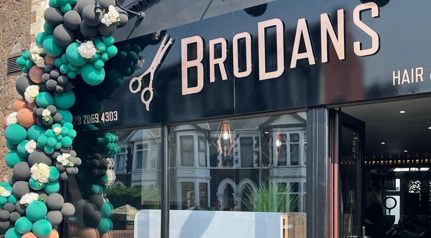 Entrance of BroDans Hair & Beauty Lounge with decorative balloons in Cardiff, Wales, GB.