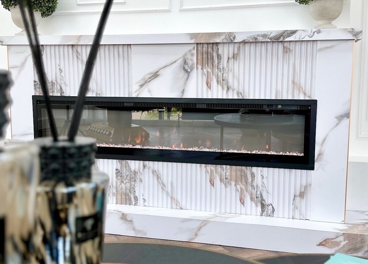 Elegant marble fireplace at Georgie’s Aesthetics Milton Keynes, Milton Keynes, England, GB.