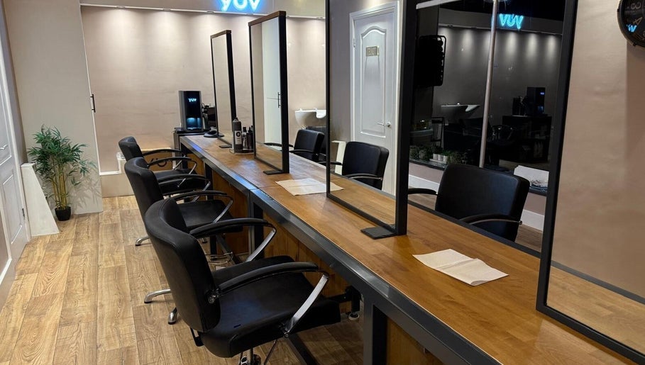 Chic salon interior at Studio 21 in Eckington, England, GB with modern chairs and mirrors.