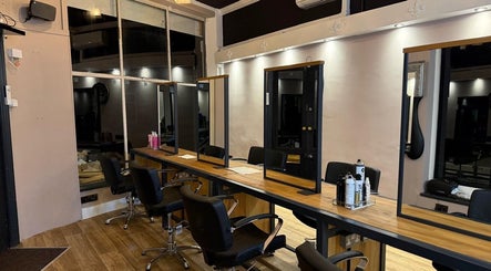 Elegant hair styling chairs and mirrors at Studio 21 in Eckington, England, GB, offering a serene design.