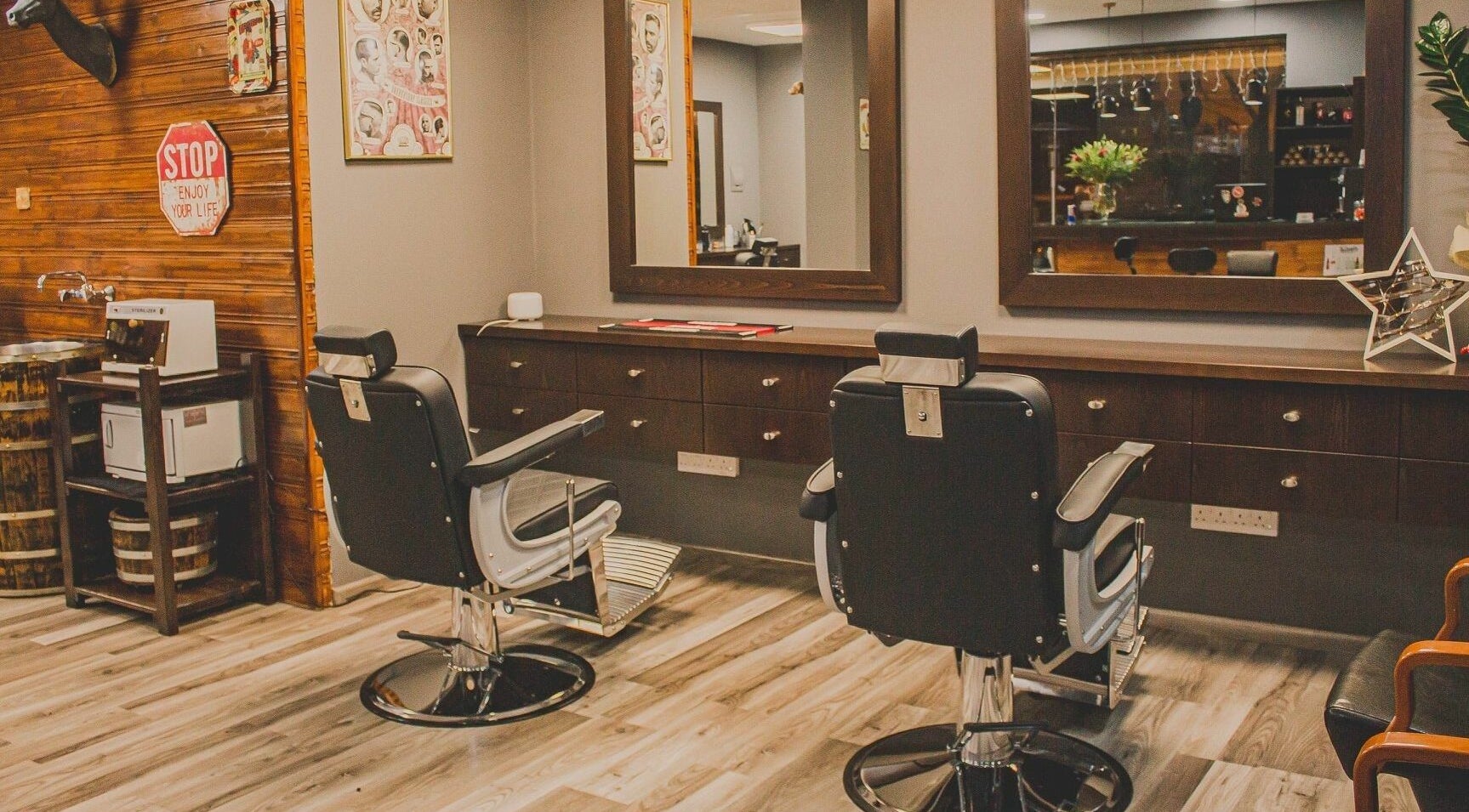 Chic interior of Mancave Barbershop in Limassol, CY featuring modern styling chairs and mirrors.