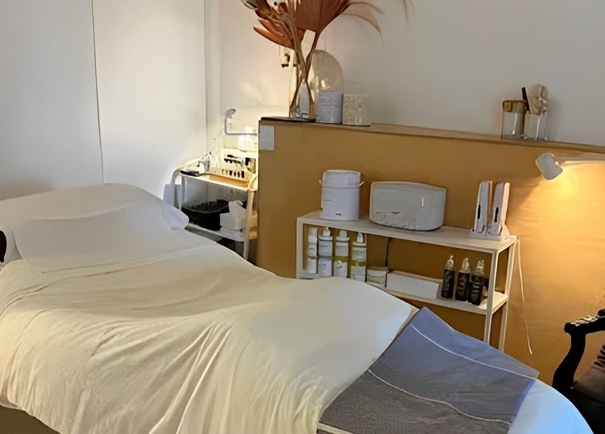 Cozy treatment room at Luxe Pacifique in Byron Bay, New South Wales, AU featuring a massage table and relaxing decor.