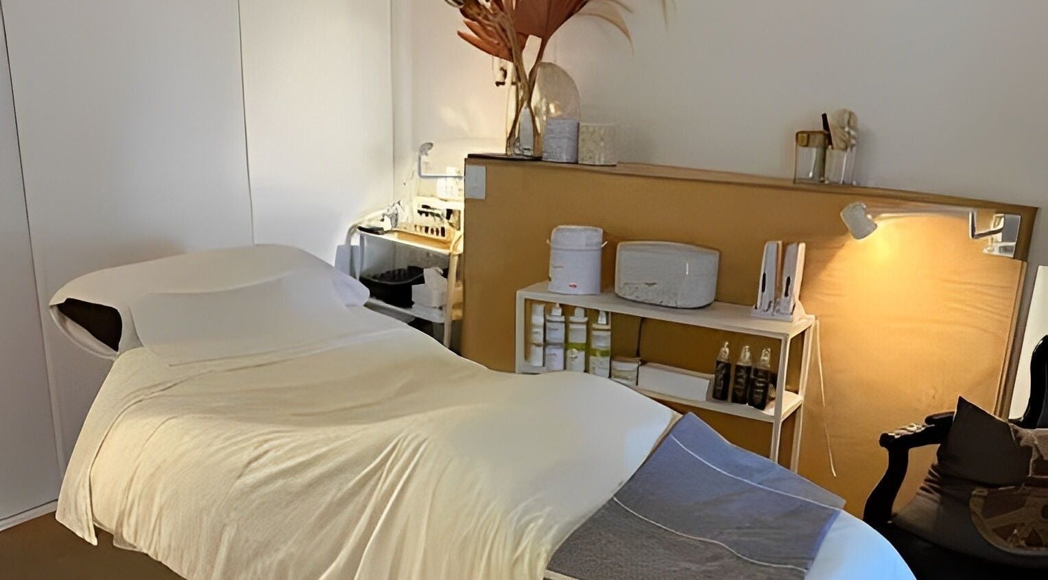 Cozy treatment room at Luxe Pacifique in Byron Bay, New South Wales, AU featuring a massage table and relaxing decor.