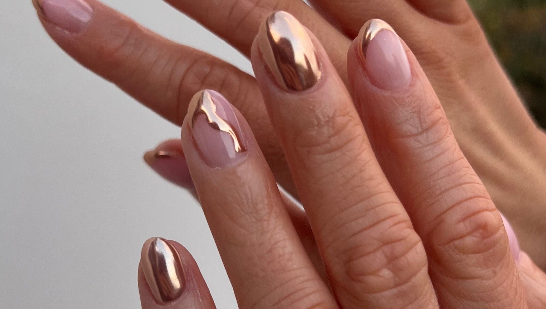 Elegant metallic nail art at Mint Beauty, Coleraine, Northern Ireland, GB. Shiny, stylish manicure.
