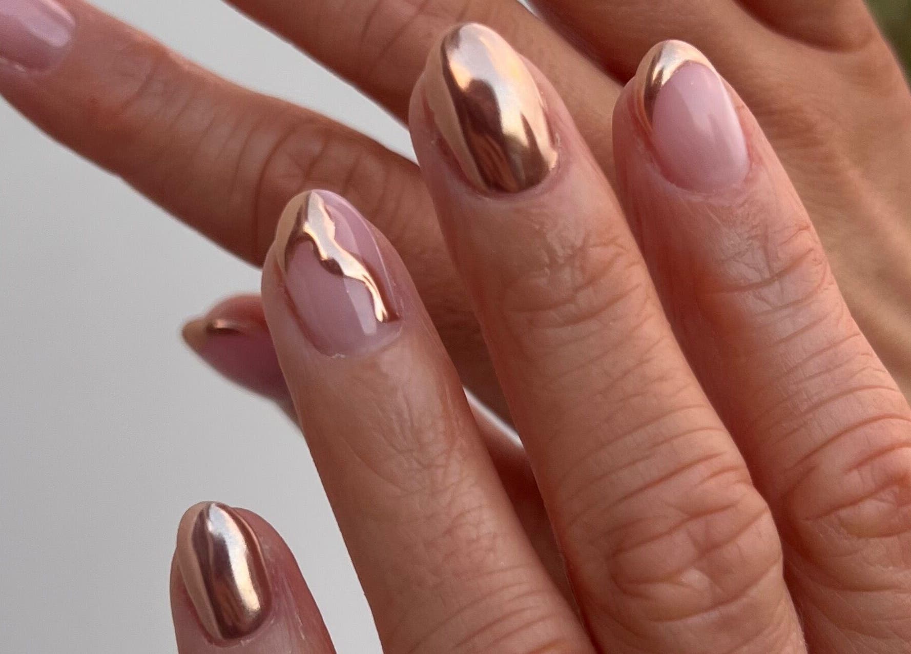 Elegant metallic nail art at Mint Beauty, Coleraine, Northern Ireland, GB. Shiny, stylish manicure.