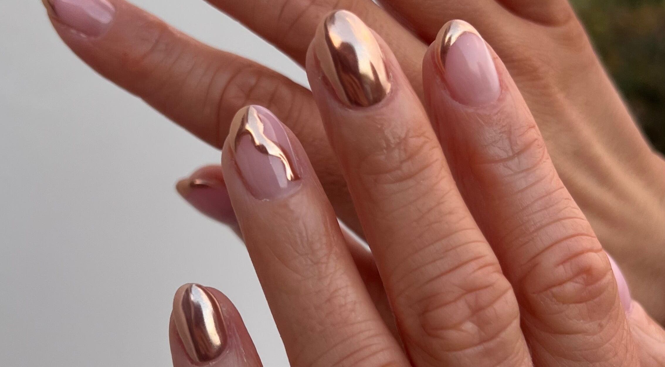 Elegant metallic nail art at Mint Beauty, Coleraine, Northern Ireland, GB. Shiny, stylish manicure.