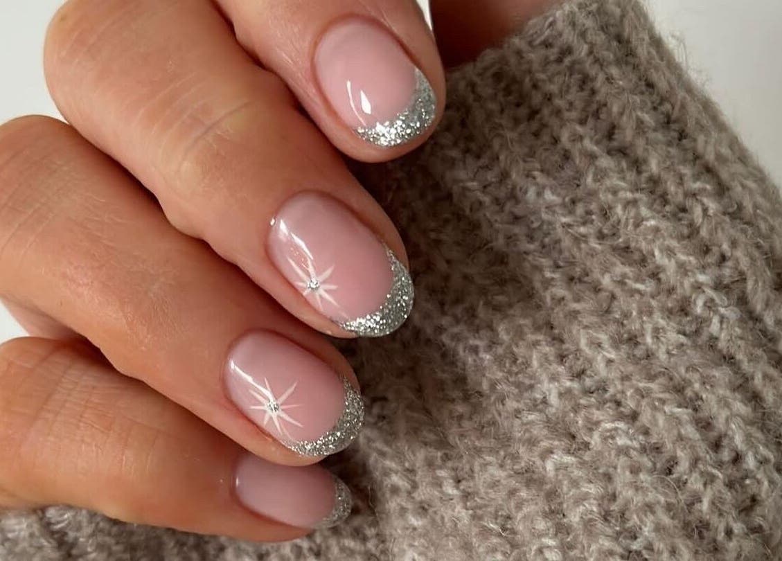Elegant silver glitter French manicure from Mint Beauty in Coleraine, Northern Ireland, GB.