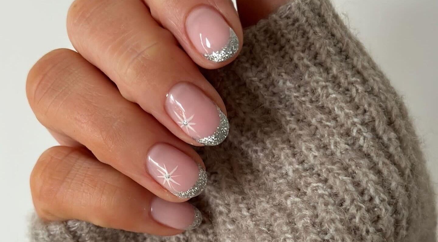 Elegant silver glitter French manicure from Mint Beauty in Coleraine, Northern Ireland, GB.