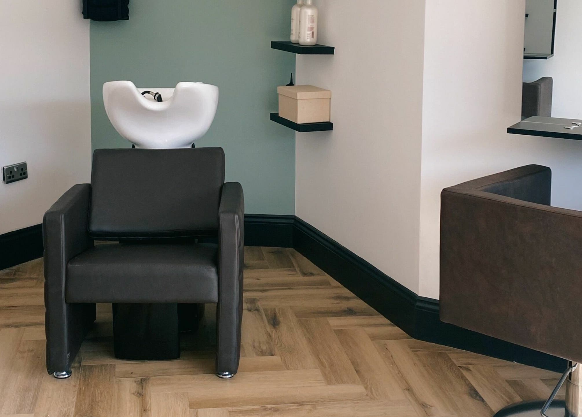 Sleek hair wash station at Leanne Alexandra, Bolton, England, GB. Modern design with minimalist decor.