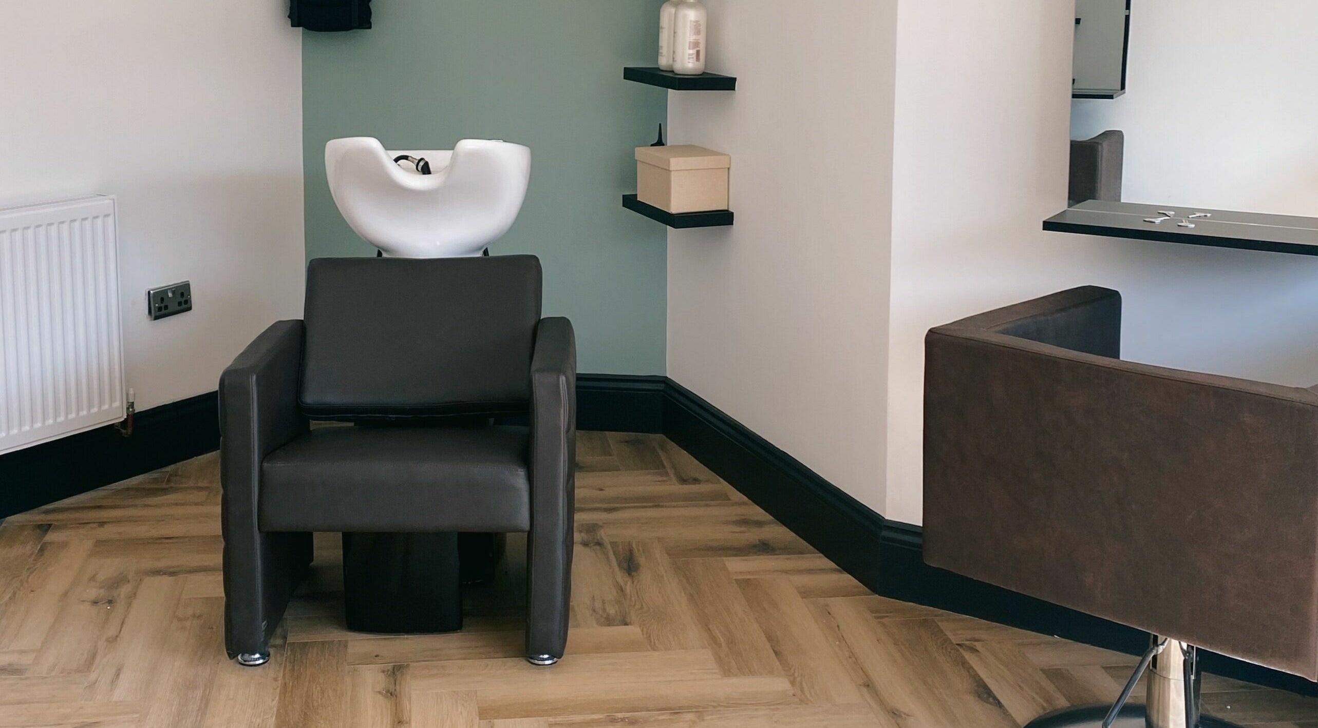 Sleek hair wash station at Leanne Alexandra, Bolton, England, GB. Modern design with minimalist decor.