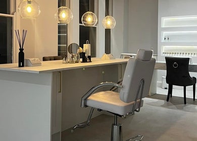 Sophisticated interior of The Bella Lounge, Plymouth, England, featuring modern beauty stations.