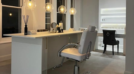 Sophisticated interior of The Bella Lounge, Plymouth, England, featuring modern beauty stations.