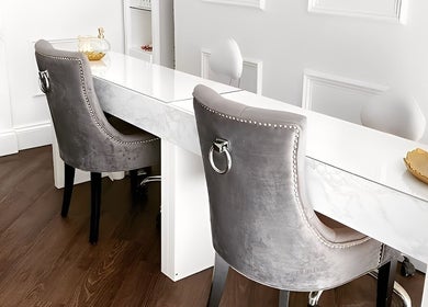 Elegant manicure station at The Bella Lounge, Plymouth, England, GB, featuring plush gray chairs and chic decor.