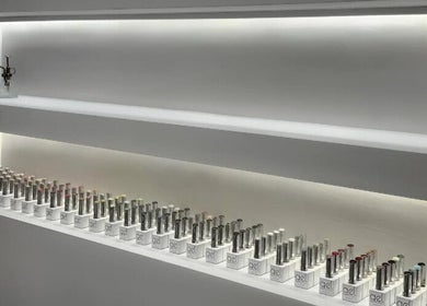 Elegant nail polish display at The Bella Lounge, Plymouth, England, GB, showcasing a variety of gel colors.