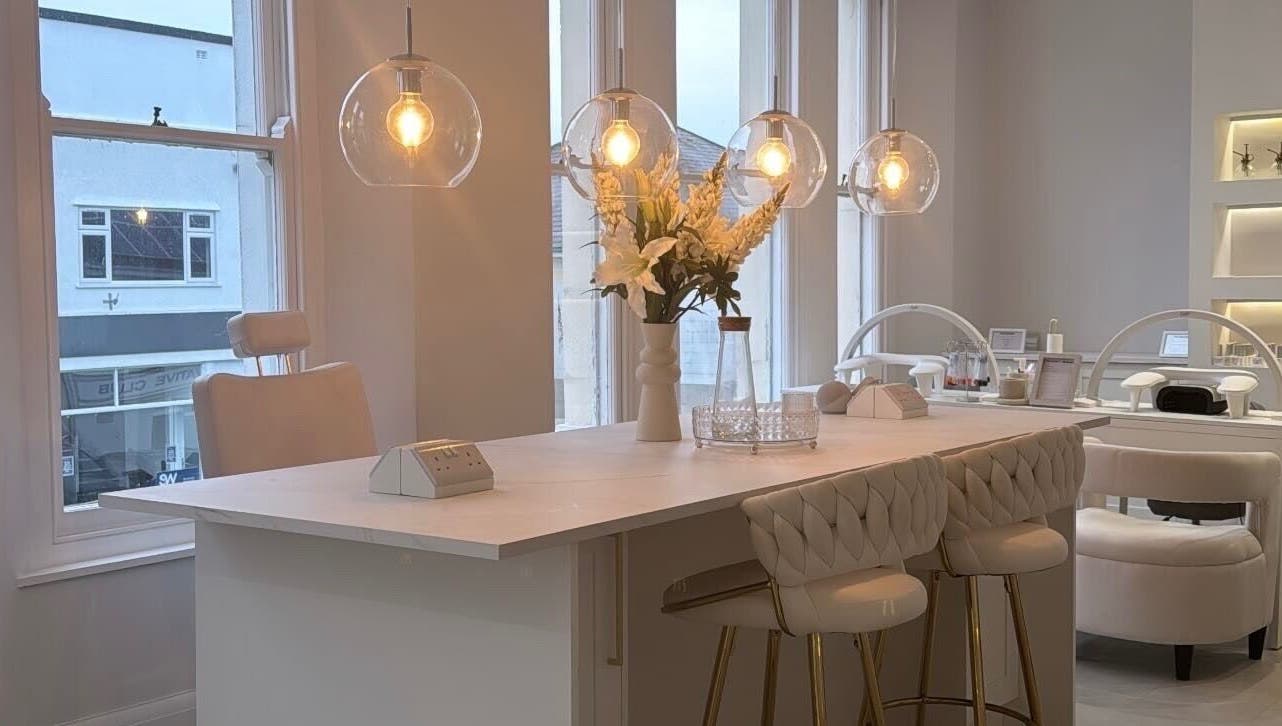 Elegant beauty space at The Bella Lounge, Plymouth, England with chic decor and soft lighting.