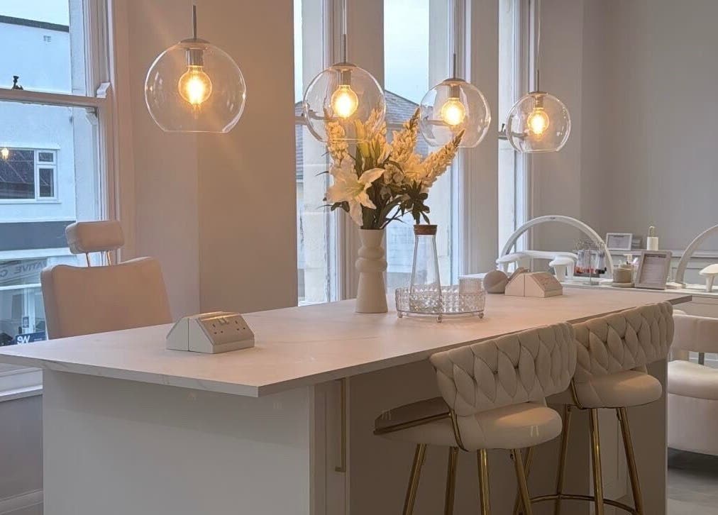 Elegant beauty space at The Bella Lounge, Plymouth, England with chic decor and soft lighting.