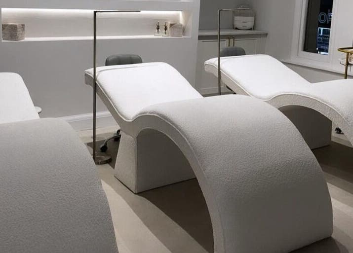 Modern treatment beds at The Bella Lounge, Plymouth, England, GB, invite relaxation in a serene ambiance.