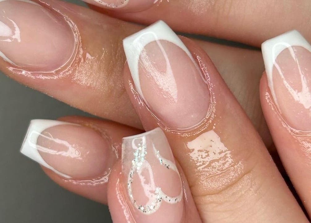 Elegant French manicure with heart details at The Bella Lounge, Plymouth, England, GB.