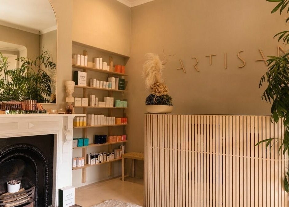 Artisan Skin reception, Cape Town. Natural decor with plants and shelves of beauty products in Western Cape, ZA.