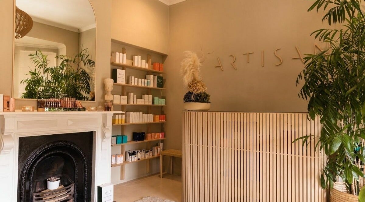 Artisan Skin reception, Cape Town. Natural decor with plants and shelves of beauty products in Western Cape, ZA.