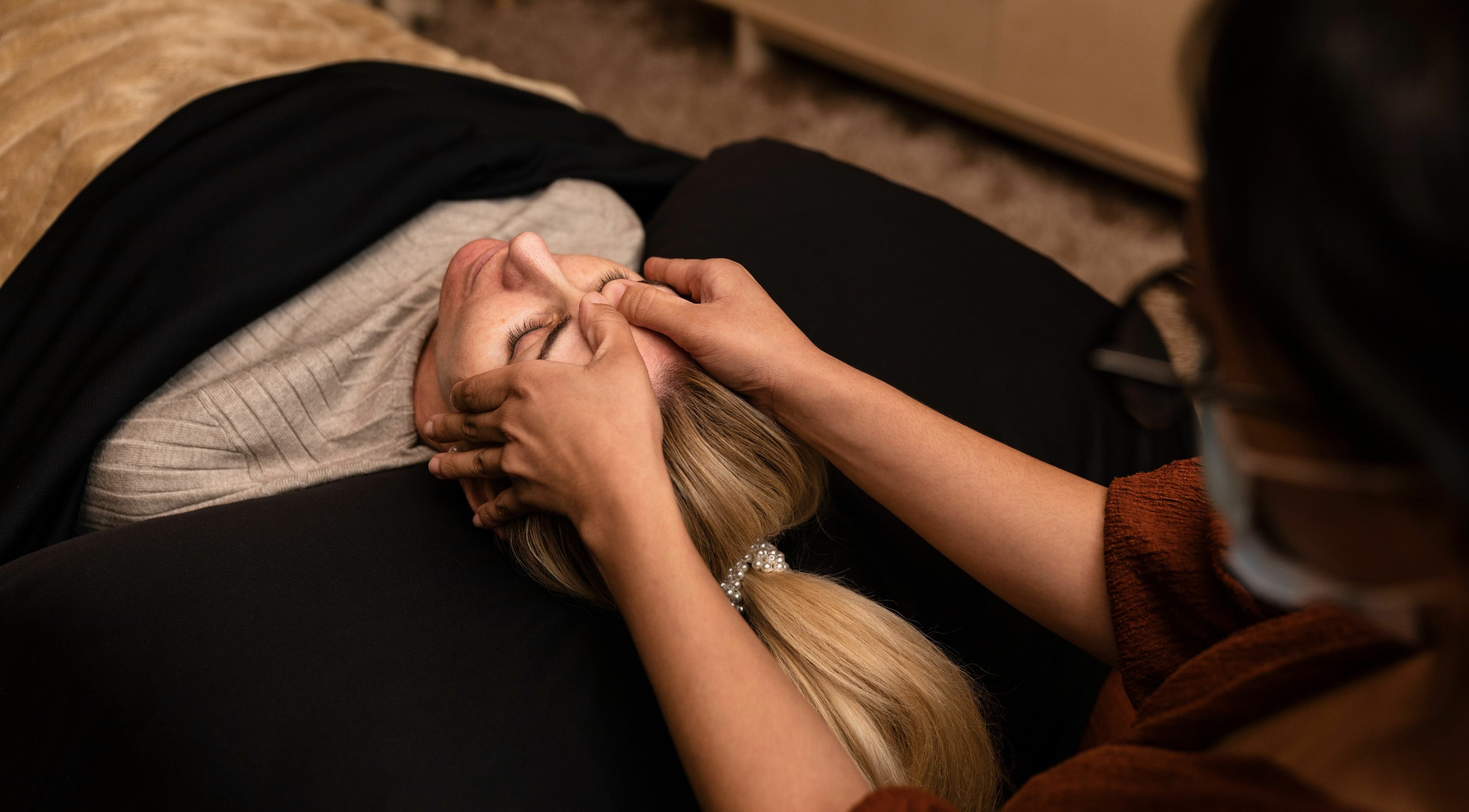 Facial massage at Artisan Skin in Cape Town, Western Cape, ZA. Gentle hands pamper a relaxed client.