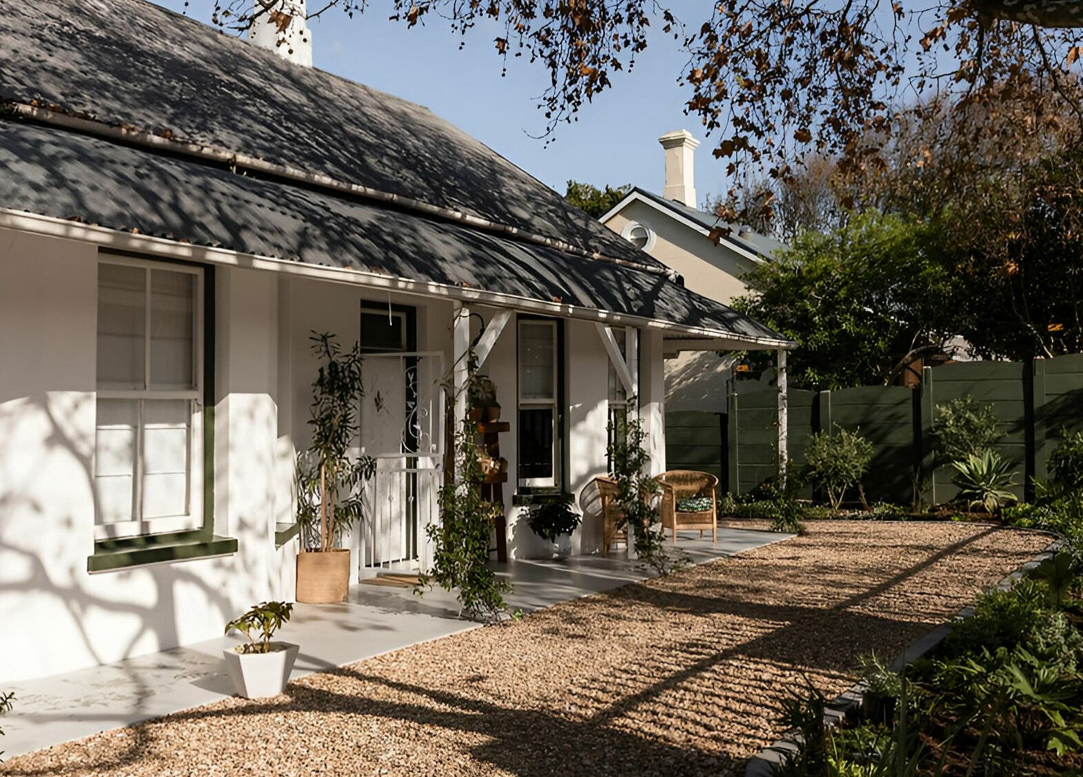Charming entrance to Artisan Skin, Cape Town, Western Cape, ZA, adorned with lush greenery.
