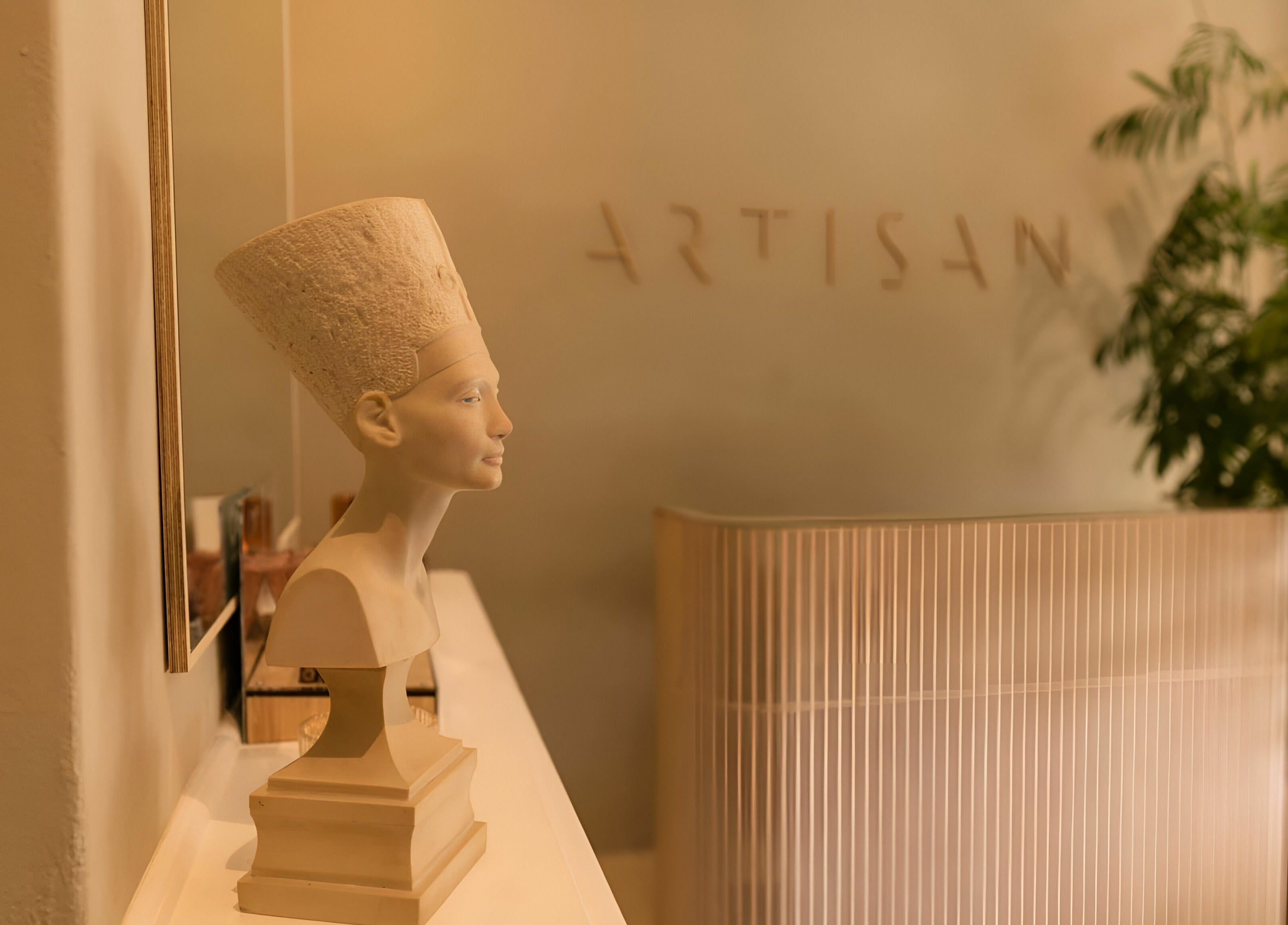 Nefertiti bust at Artisan Skin entrance in Cape Town, Western Cape, ZA, showcasing elegance and style.