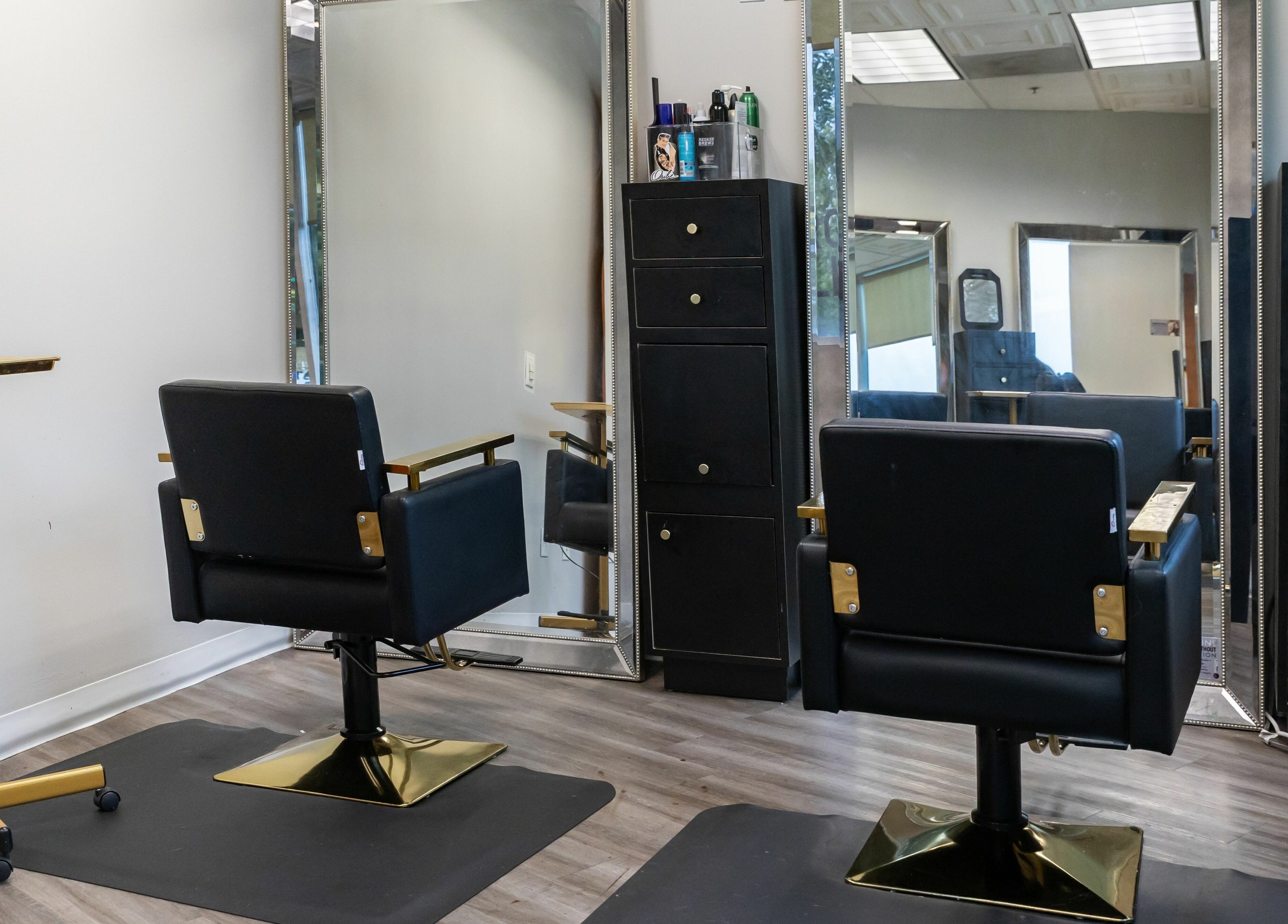 Modern salon chairs and mirrors at So Luxe Salon in Rancho Cucamonga, California, US.