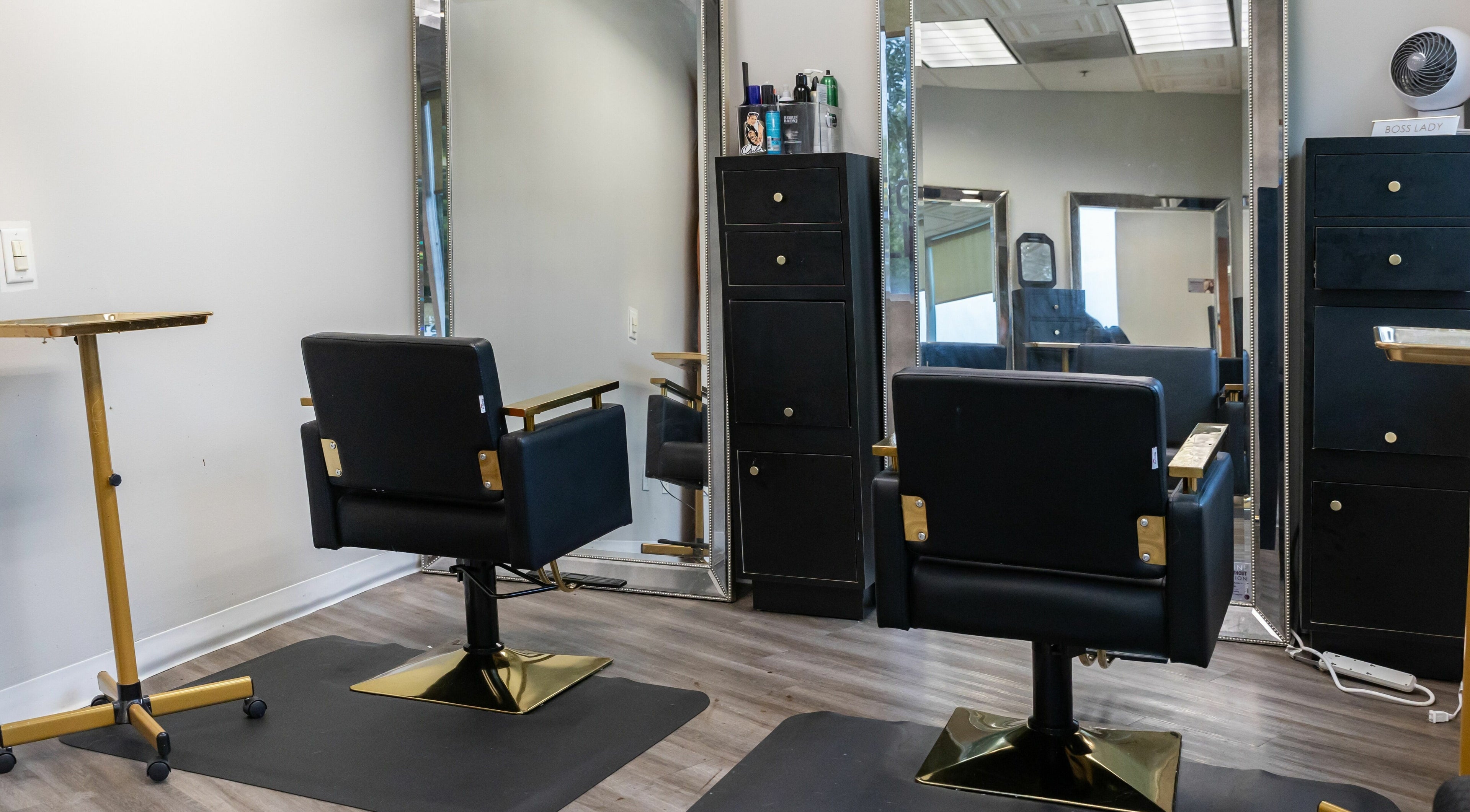 Modern salon chairs and mirrors at So Luxe Salon in Rancho Cucamonga, California, US.