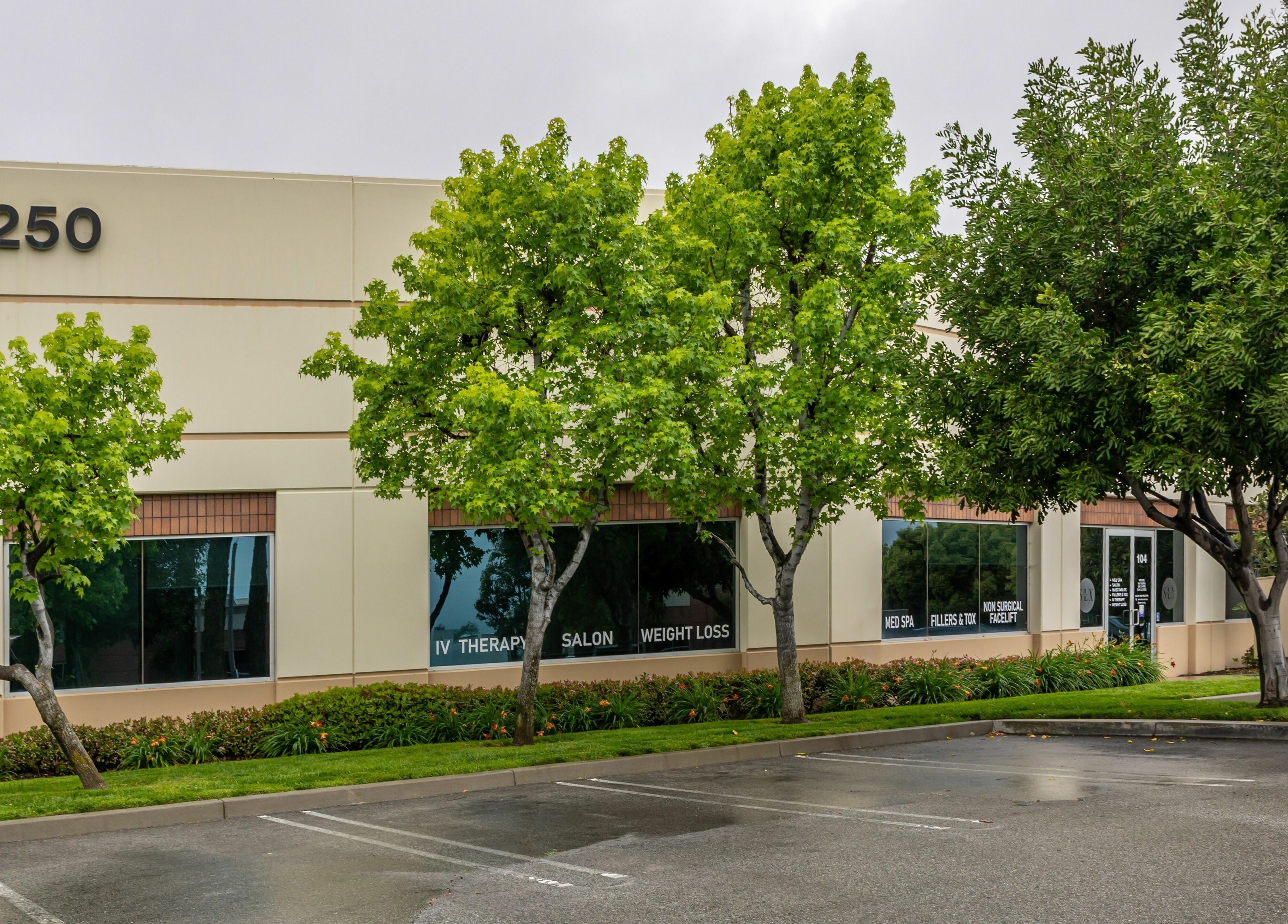 Exterior of So Luxe Salon in Rancho Cucamonga, California, US showcasing its serene, lush surroundings.