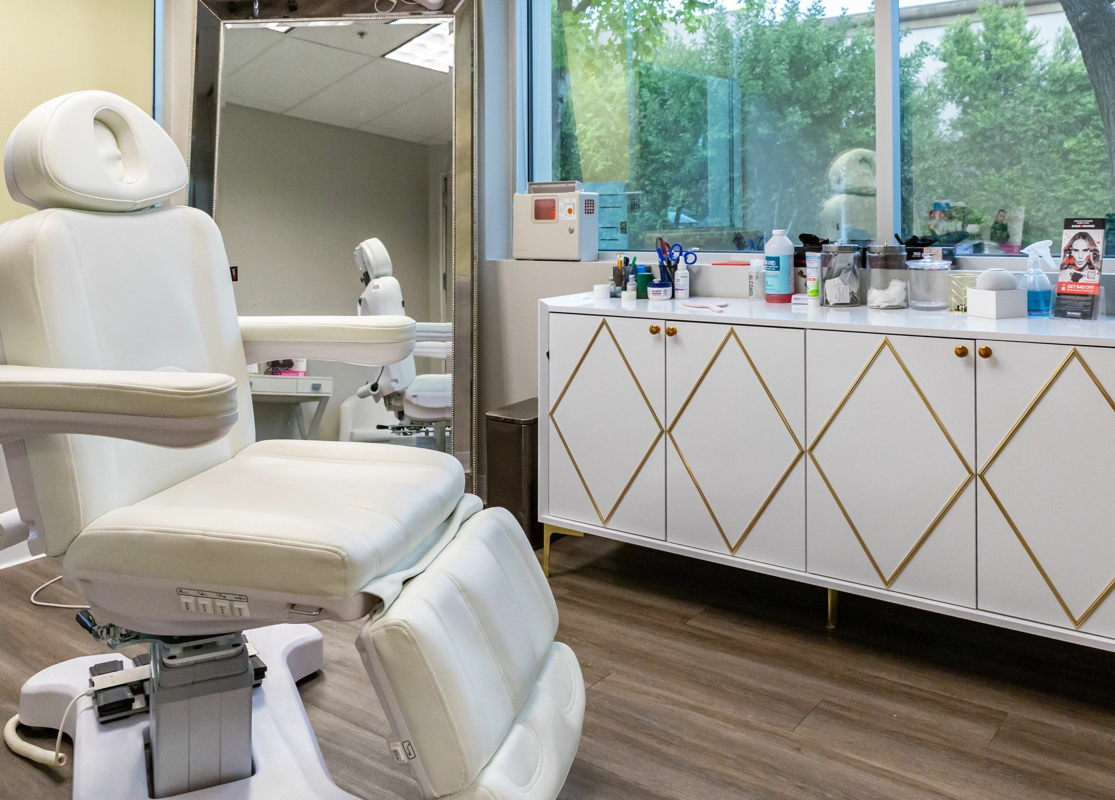 Luxurious treatment room at So Luxe Med Spa, Rancho Cucamonga, California, US, featuring a plush white chair.