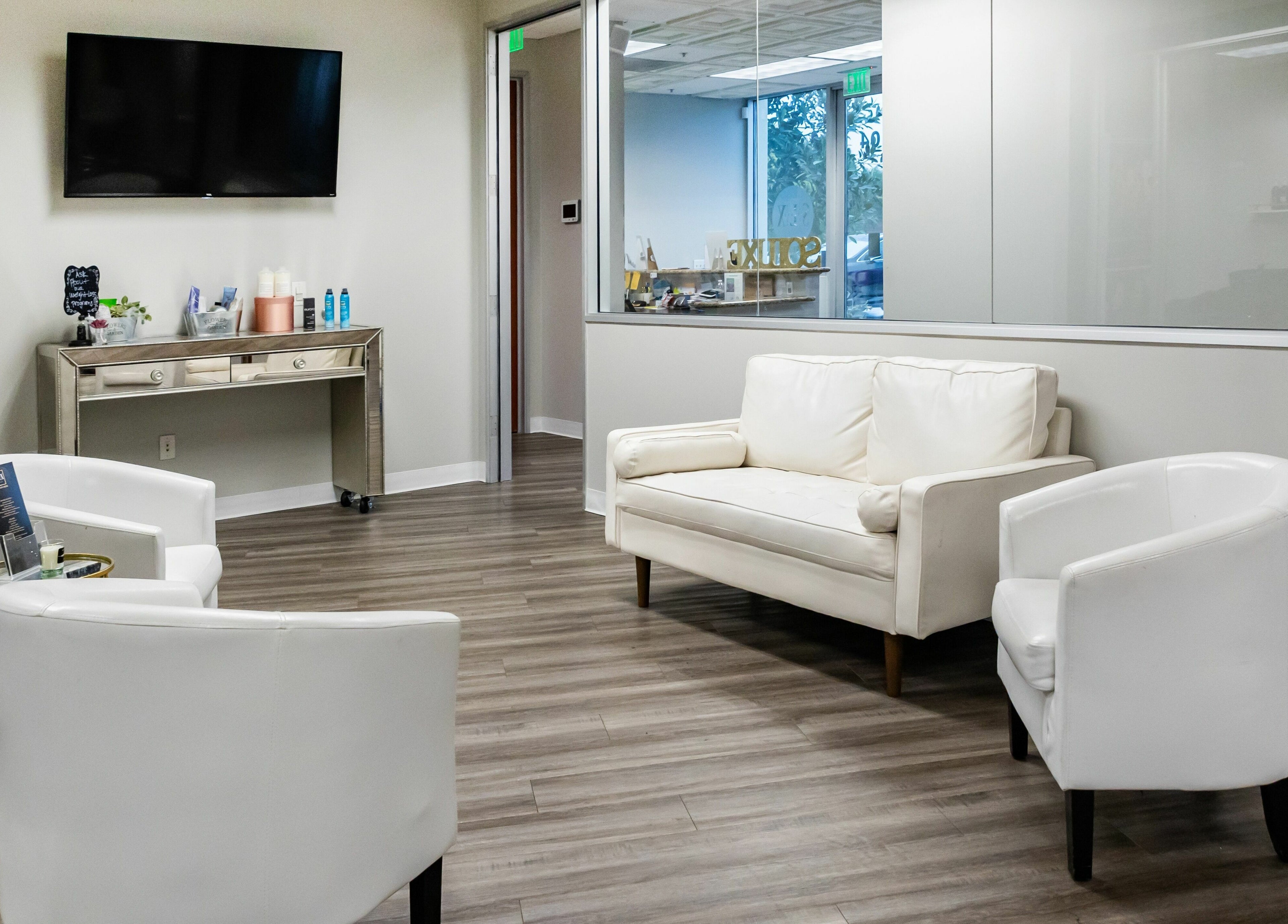 Chic waiting area at So Luxe Med Spa, Rancho Cucamonga, California, US with plush seating and modern decor.