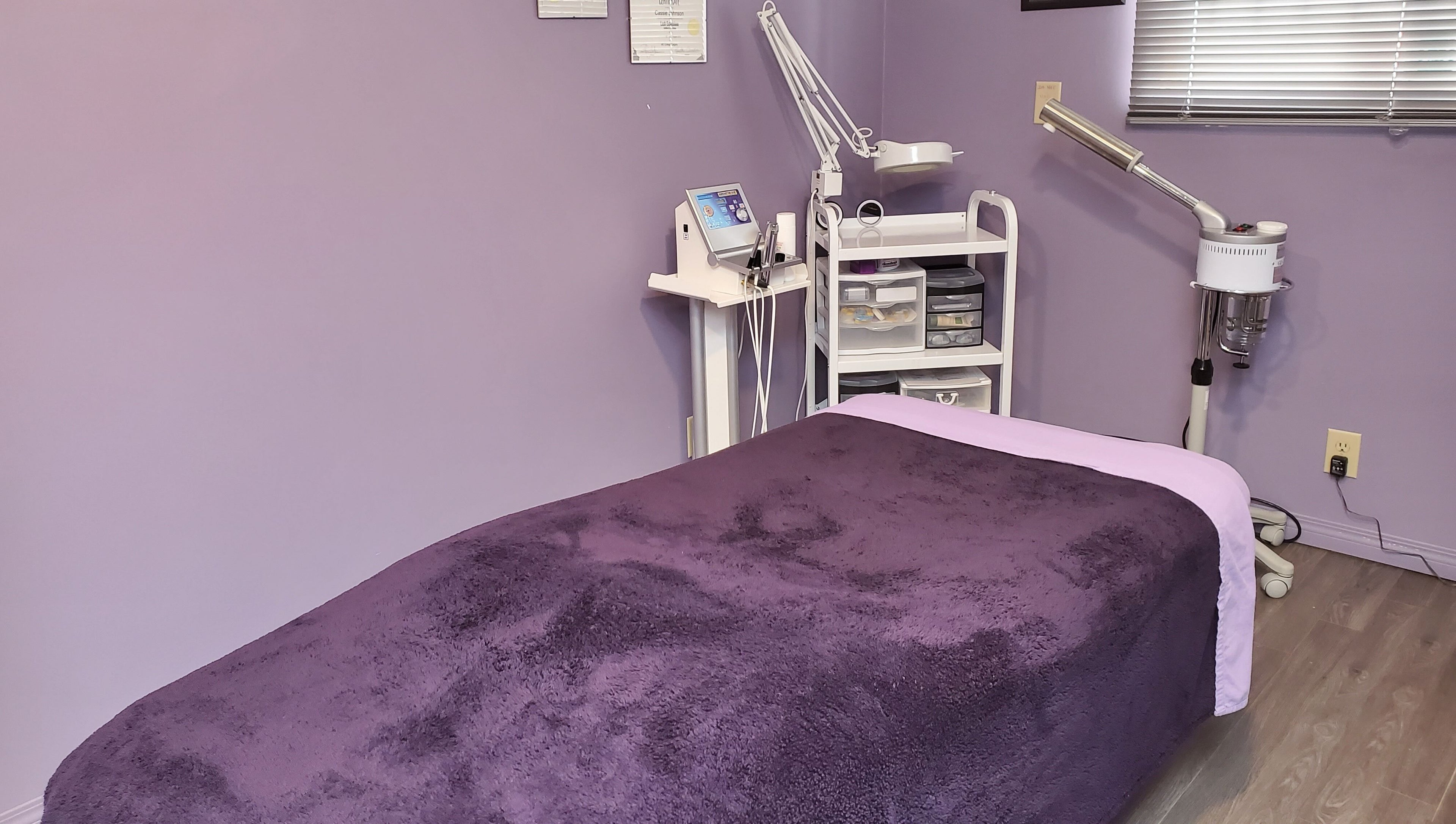 Relaxing treatment room at Stylz Salon & Spa in Strathmore, Alberta, CA with cozy massage bed.