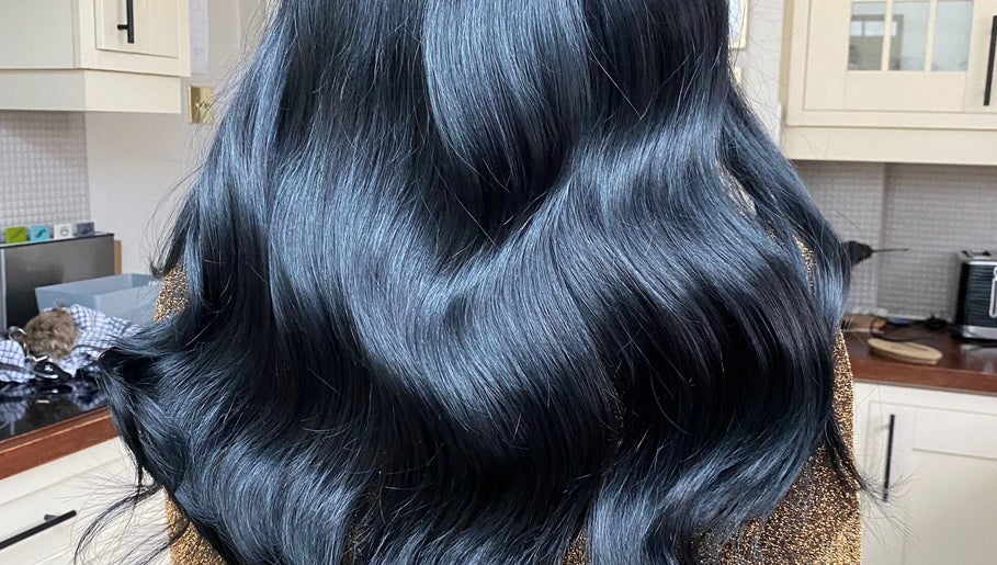 Shiny black hair styled at Hair Crown, London, England, GB.