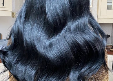 Shiny black hair styled at Hair Crown, London, England, GB.