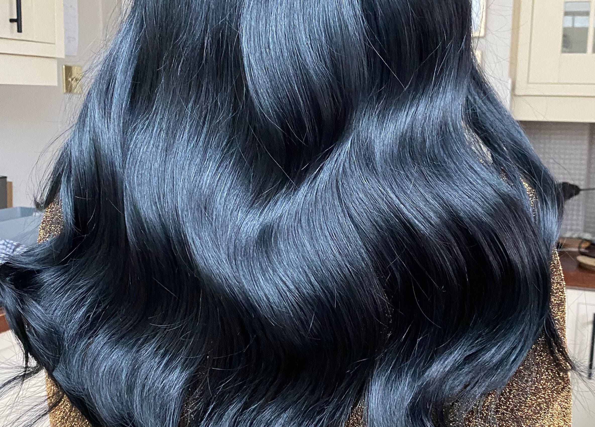 Shiny black hair styled at Hair Crown, London, England, GB.