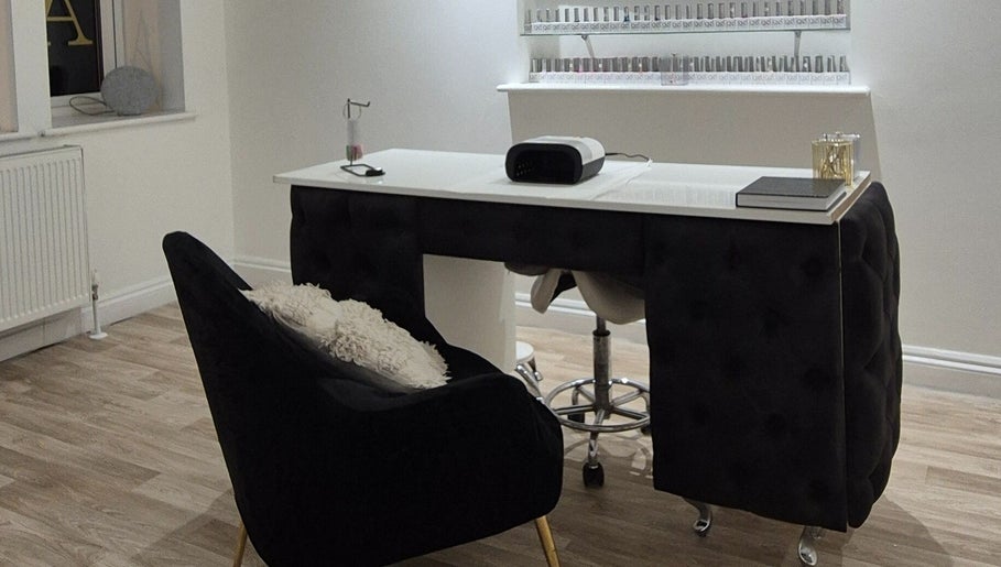 Chic nail studio at Meraki in Shaw, England, GB featuring a modern manicure setup and shelves of nail polish.