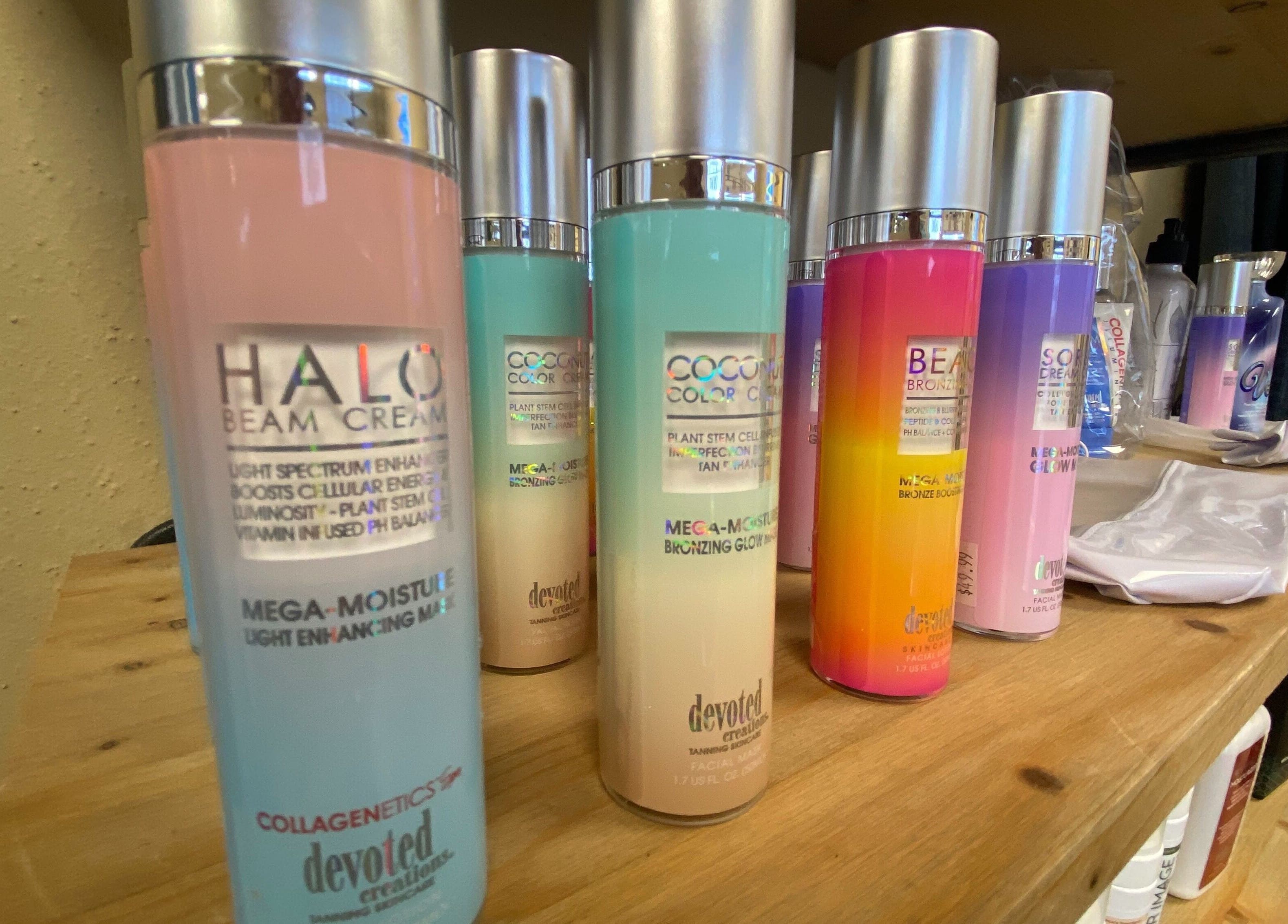 Diverse skincare bottles on a shelf at Solar Image, Lufkin, Texas, US, showcasing beauty products.