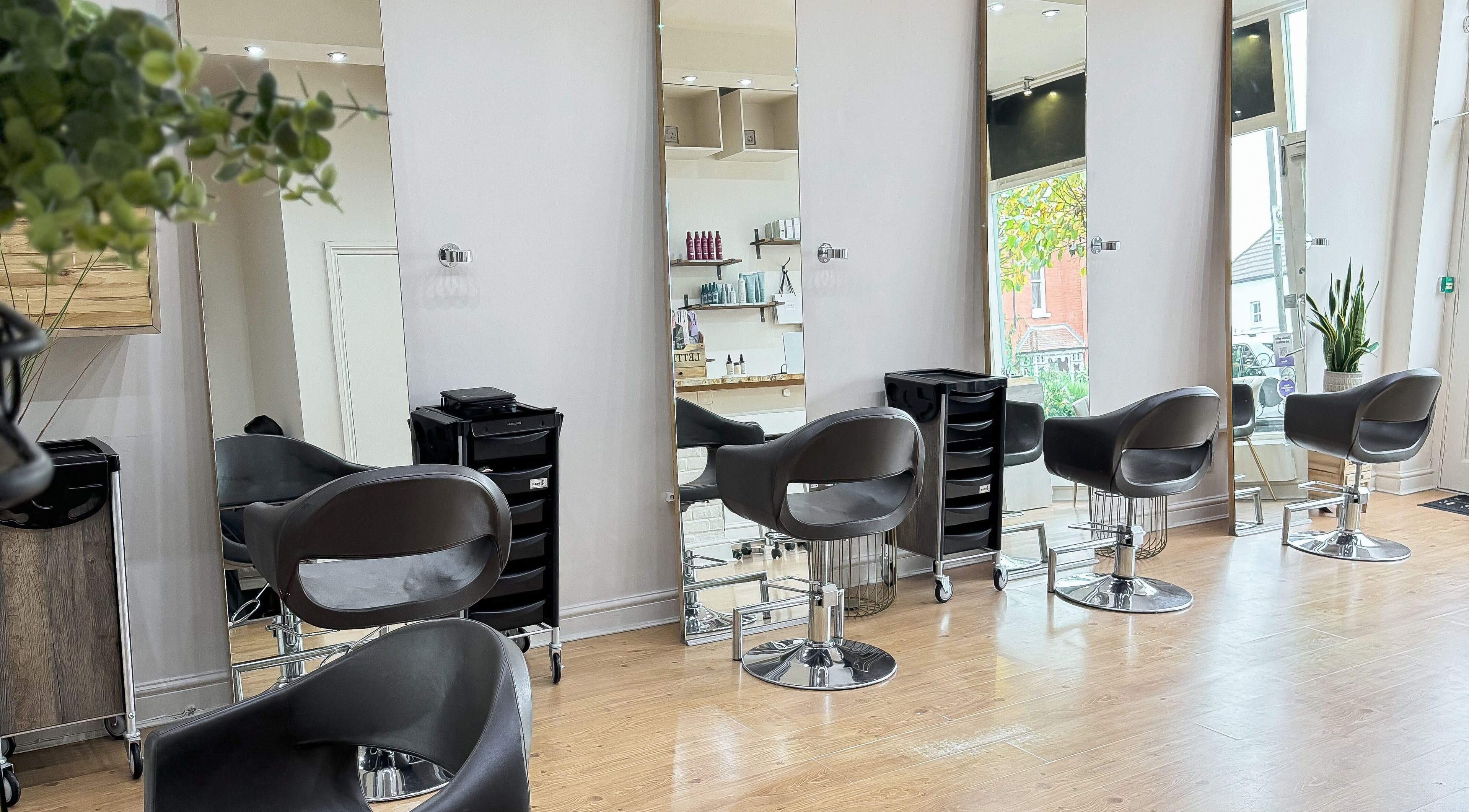 Modern salon chairs and mirrors at Image London - Tooting Moyser Road, London, England, GB.