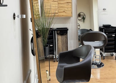 Modern salon interior at Image London - Tooting Moyser Road, London, England, GB with stylish chairs and decor.