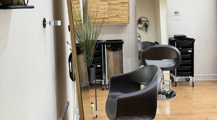 Modern salon interior at Image London - Tooting Moyser Road, London, England, GB with stylish chairs and decor.