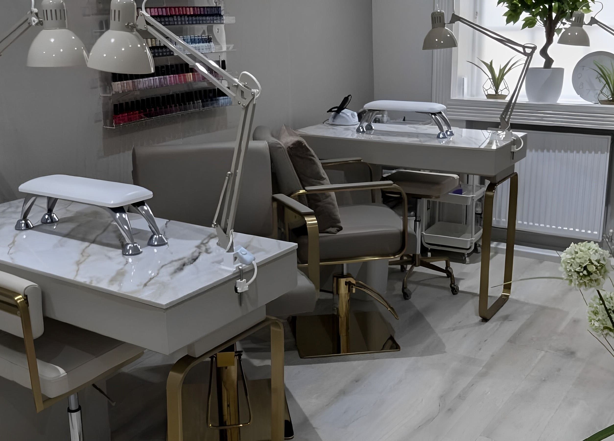 Luxurious nail station at Oxygen Beauty London in London, England, GB featuring chic décor and plush seating.